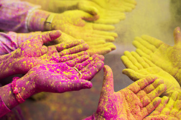 Colorful hands at the holy week in Barsana - India.